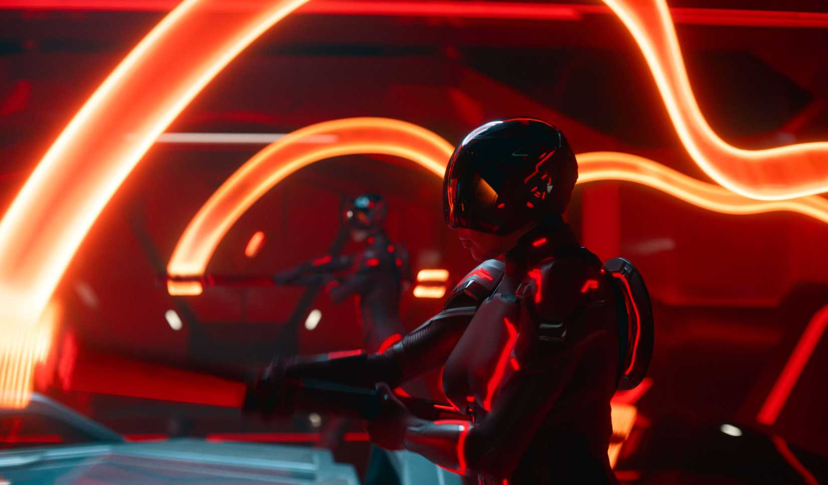 Two masked, armored black-and-neon-red humanoid figures stand amid waves of light in Tron: Ares